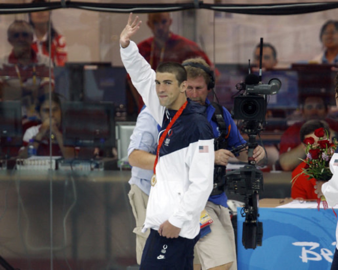 Michael Phelps waves after winning the 400m individual medley at the Beijing Olympics, August 2008